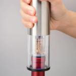 Load the wine opener electric vertically on top of the wine bottle